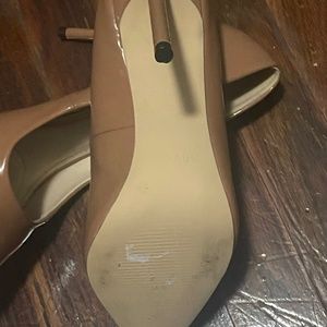 Tan patent leather pumps
